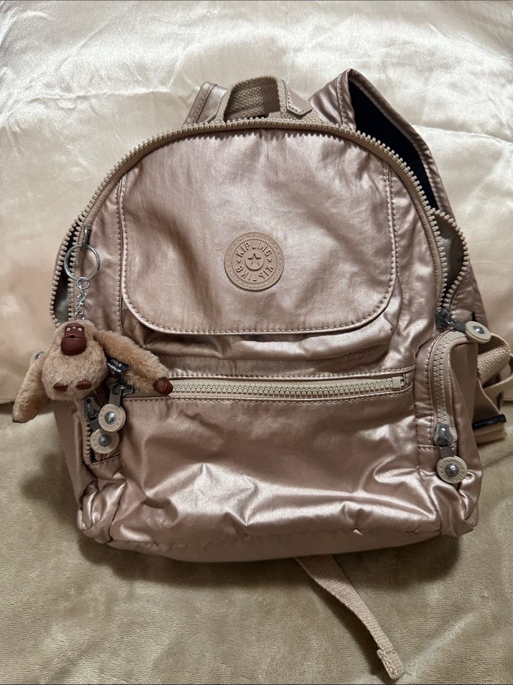 Kipling Rose Gold Mini Backpack with Monkey Charm